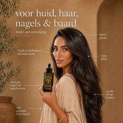 Vrouw met glanzend haar houdt pure arganolie vast – verzorging voor huid, haar, nagels en baard